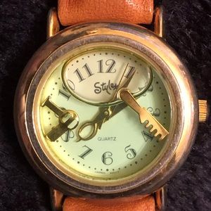 Styler Watch rose tone case with leather band